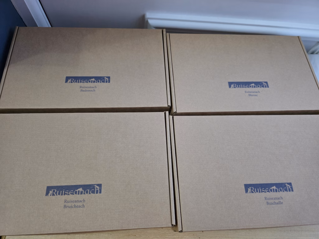 cardboard boxes with the kitten name printed on it